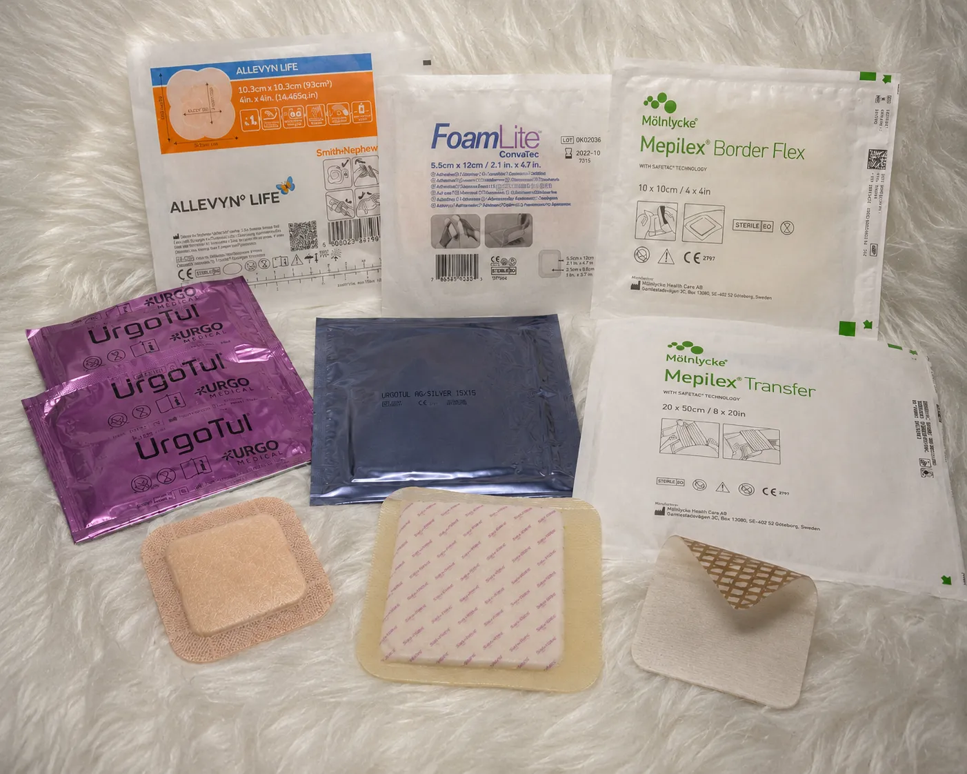 Sterile wound dressings and bandages laid out on a blanket